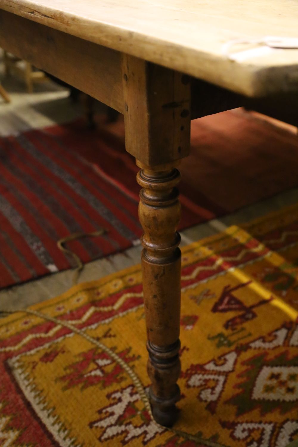 A 19th century Continental mahogany and fruitwood kitchen table, width 220cm, depth 80cm, height 75cm